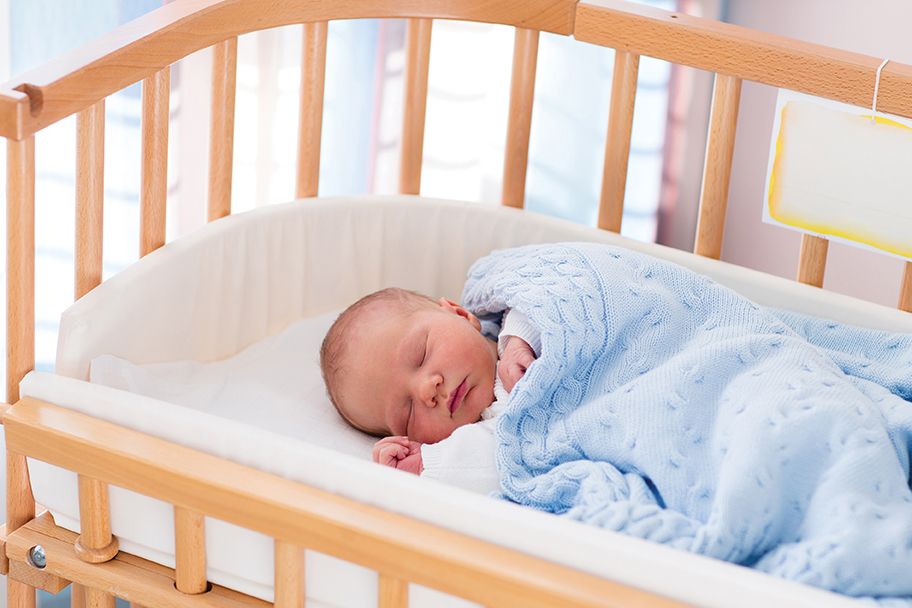 sleeping baby in cot