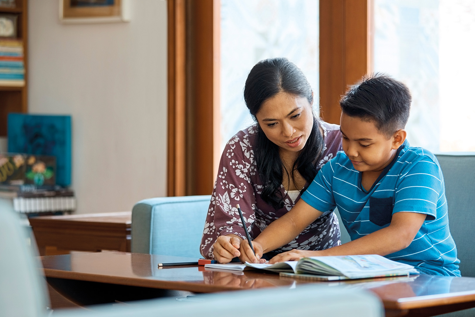 Mum helping child with homework